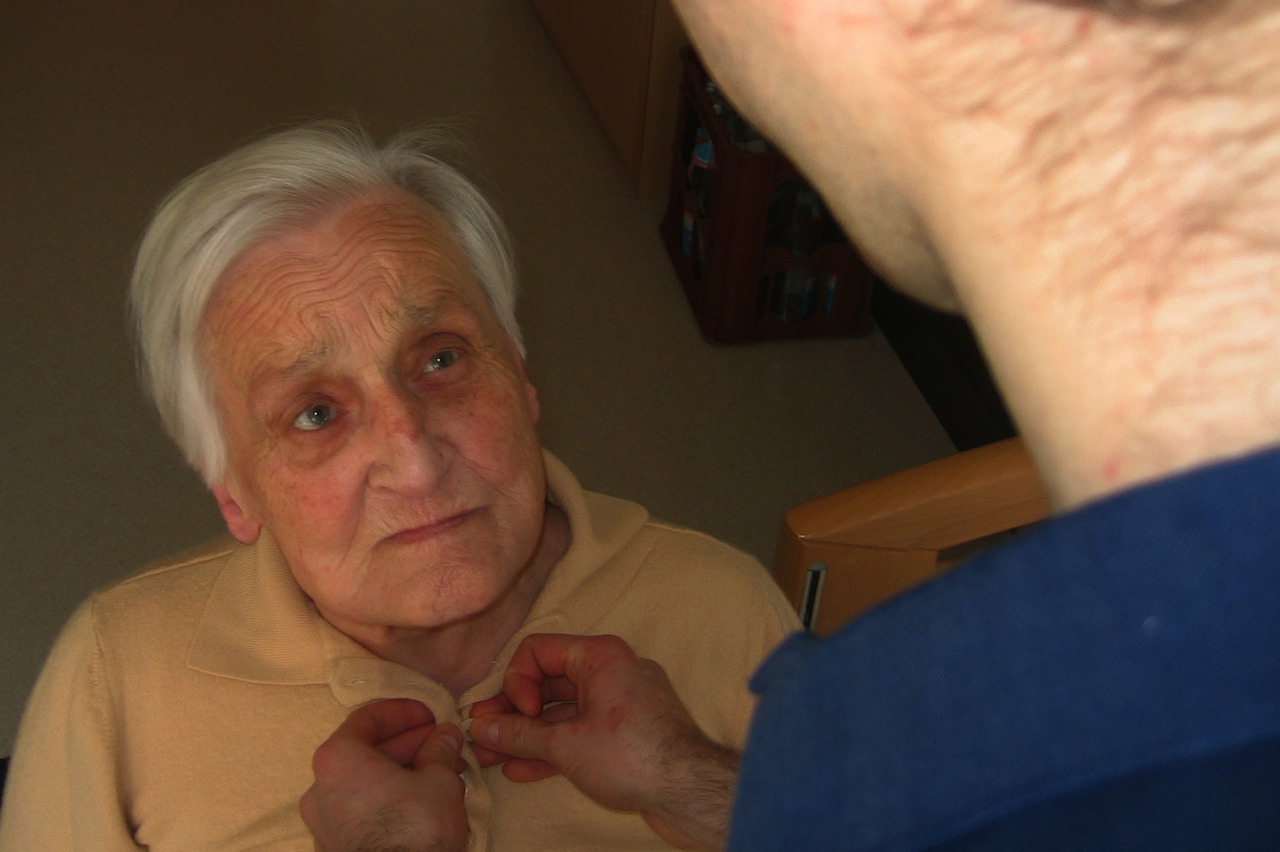 a person helping a seior 
