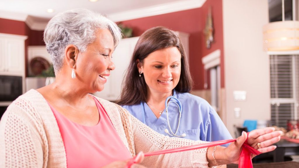 senior woman with her physical therapist